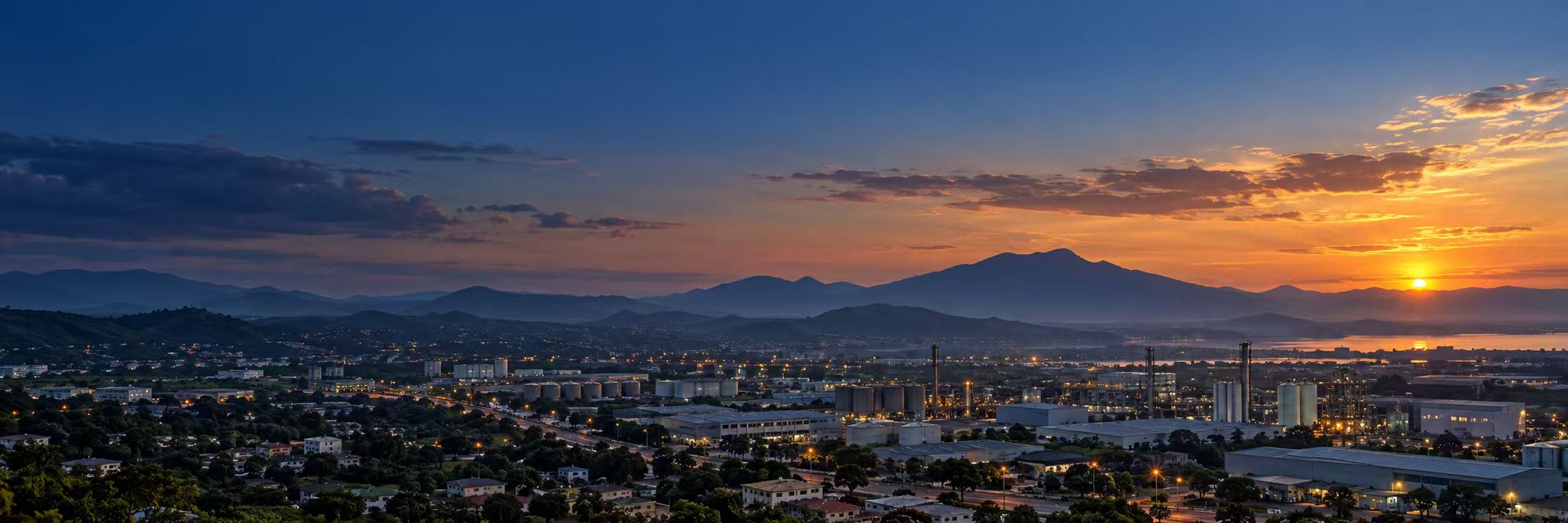 Industrial city and manufacturing district at sunset