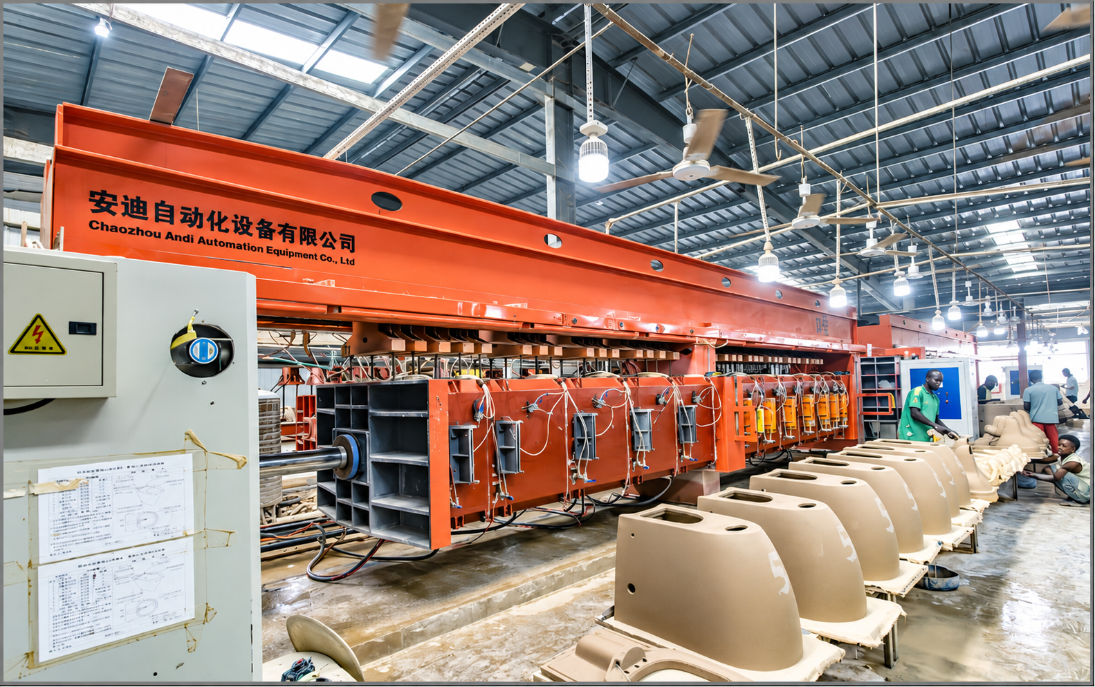 Automated sanitary ware production equipment inside a manufacturing facility