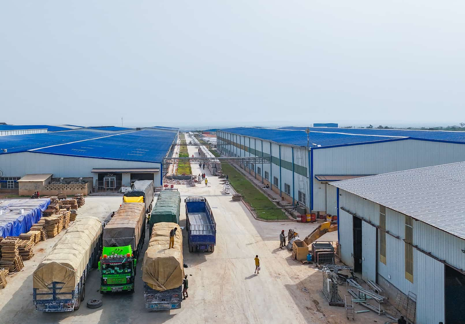 Factory road with loaded trucks